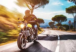 motorcycle rider biking on a main road